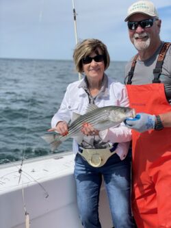 Woman holding small striper